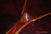 A beautiful rich cocobolo handle with a wenge edged mahogany hoop and an oak burl magnetic catch