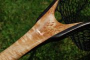 A copper Royal Wulff on Cat's Paw Burl Maple