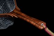 A brass inlaid fly attached by an inlaid aluminum tippet with inlaid brass,bronze,stone, copper