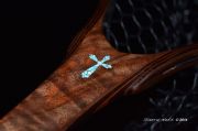 A custom Kingman Turquoise & Copper Cross