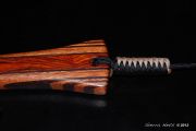 A beautiful rich cocobolo handle with a wenge edged mahogany hoop and an oak burl magnetic catch